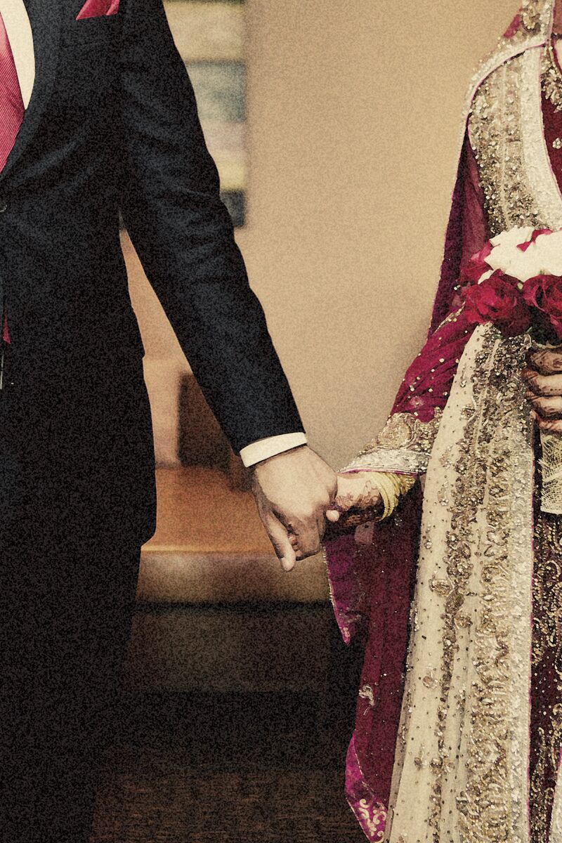 Bride and groom walking hand in hand