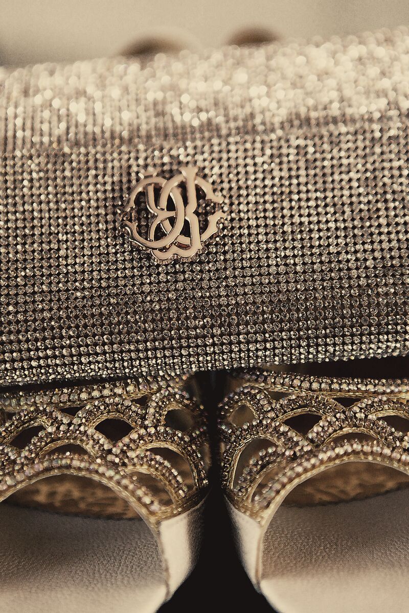 Jewelled bridal clutch above crystal heels