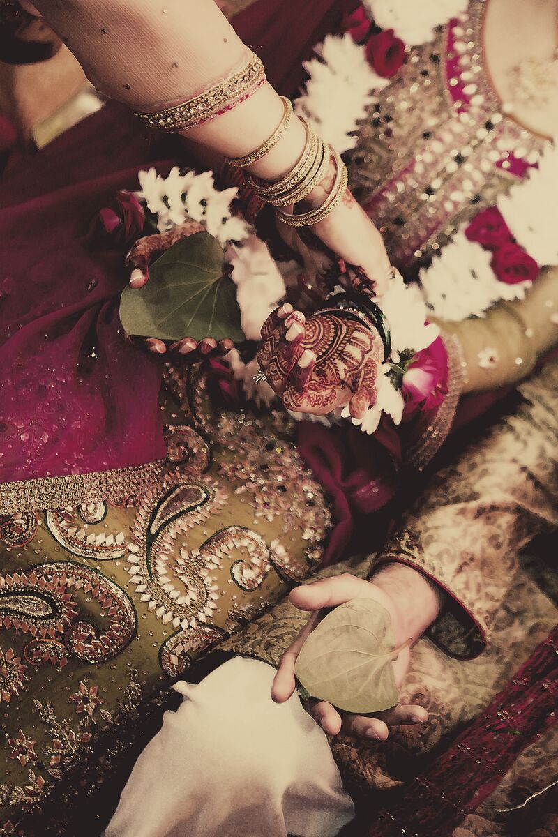 Mehndi ritual with flowers and bangles
